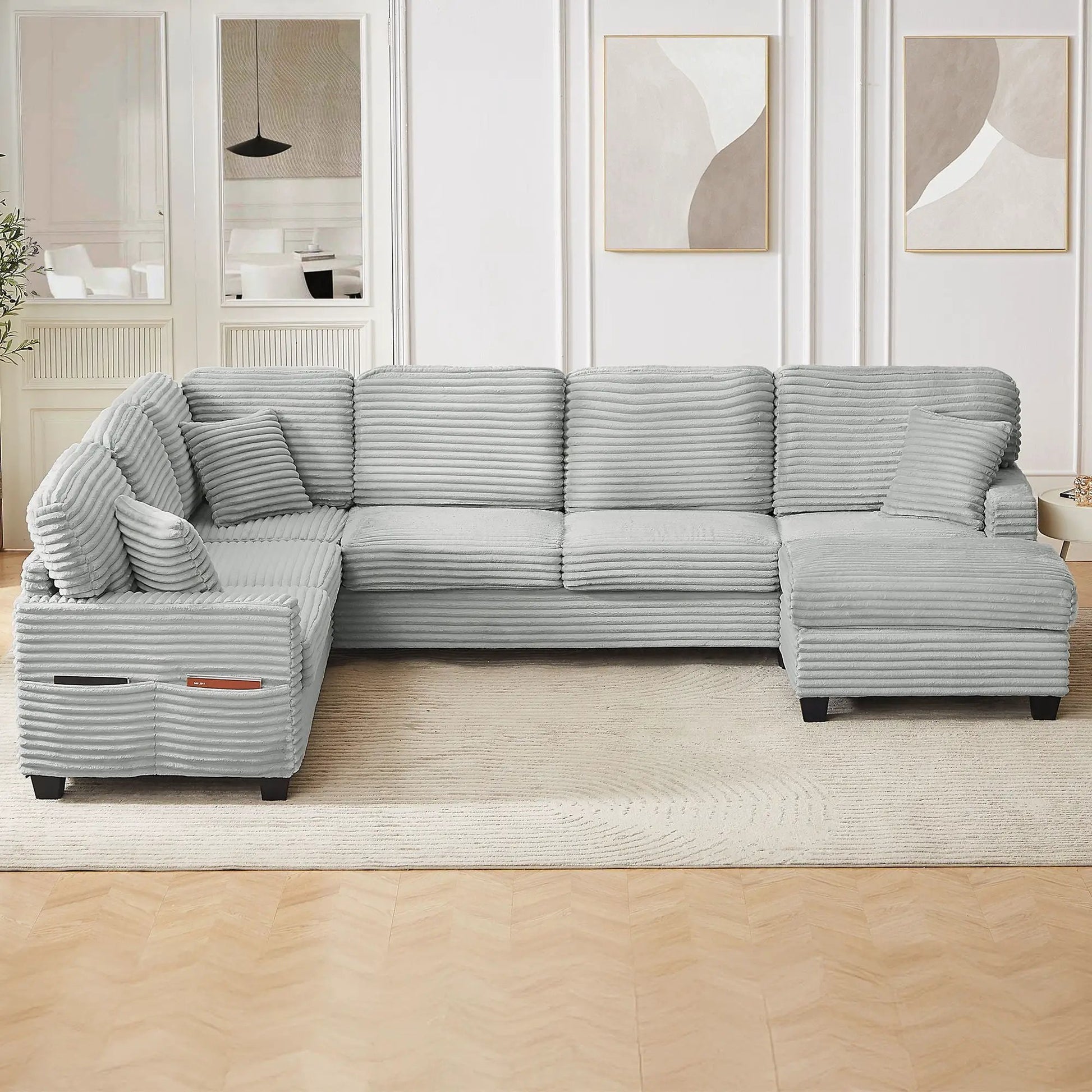 Upholstered U‑shaped sectional with movable ottoman and pockets by Unique Piece Furniture on Tampa Home & Garden Store