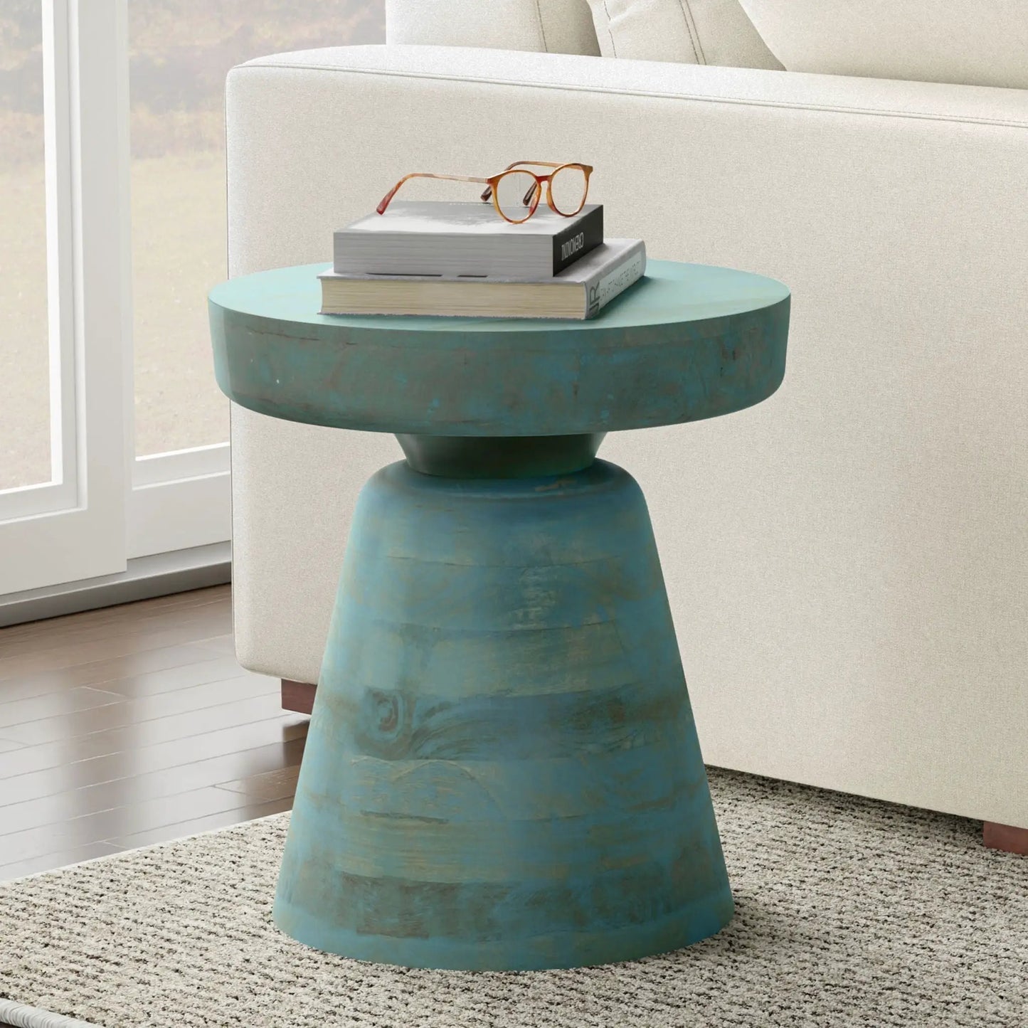 Robbie Handcrafted Accent Table turquoise pedestal base top stacked books and orange glasses on Tampa Home & Garden Store