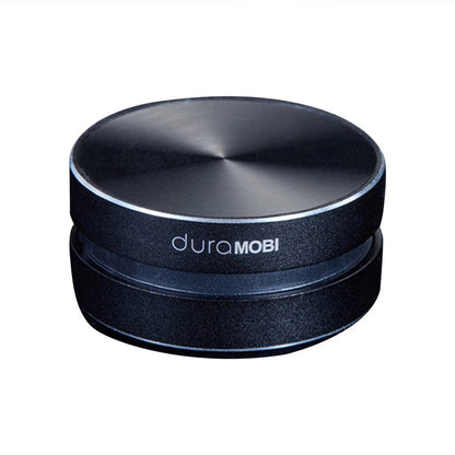 Bone conduction speaker DuraMOBI, compact circular black Bluetooth wireless speaker on Tampa Home & Garden Store