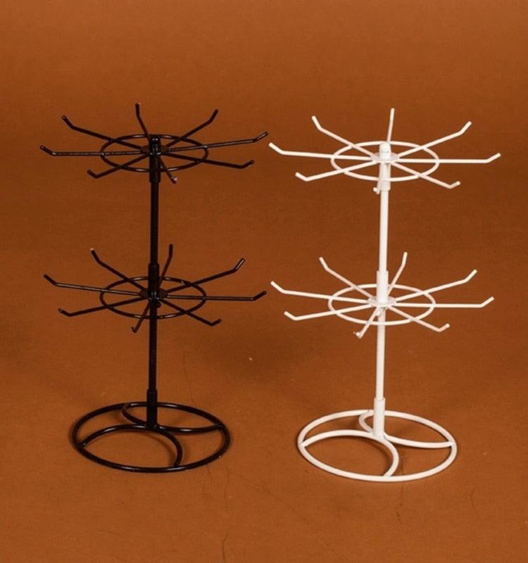 Stevvex pair of 2-tier rotating jewelry stands in black and white metal with circular bases on Tampa Home & Garden Store
