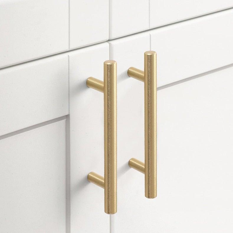 Brushed gold stainless steel T-bar cabinet handles, 2pcs, mounted on white cabinet doors on Tampa Home & Garden Store