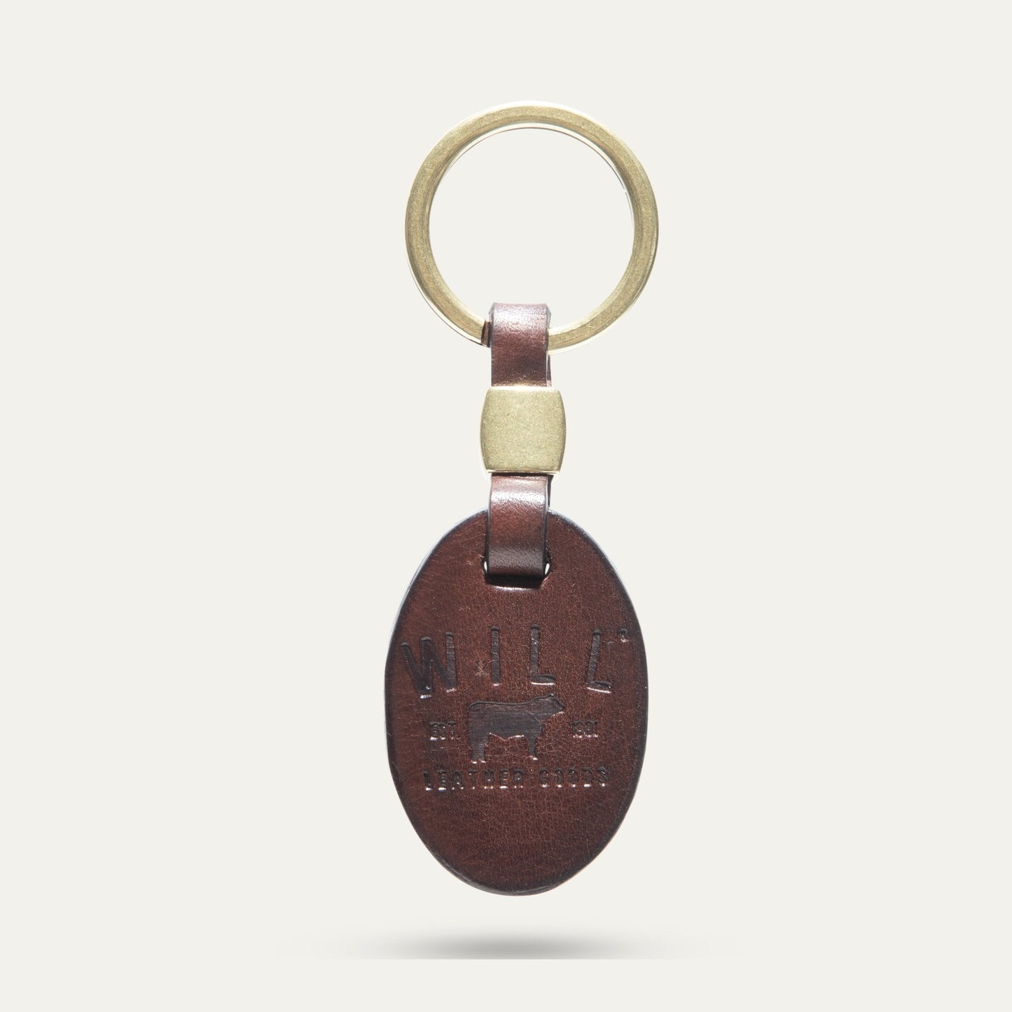 Oval key fob with gold ring and brown leather strap by Will Leather Goods on Tampa Home & Garden Store