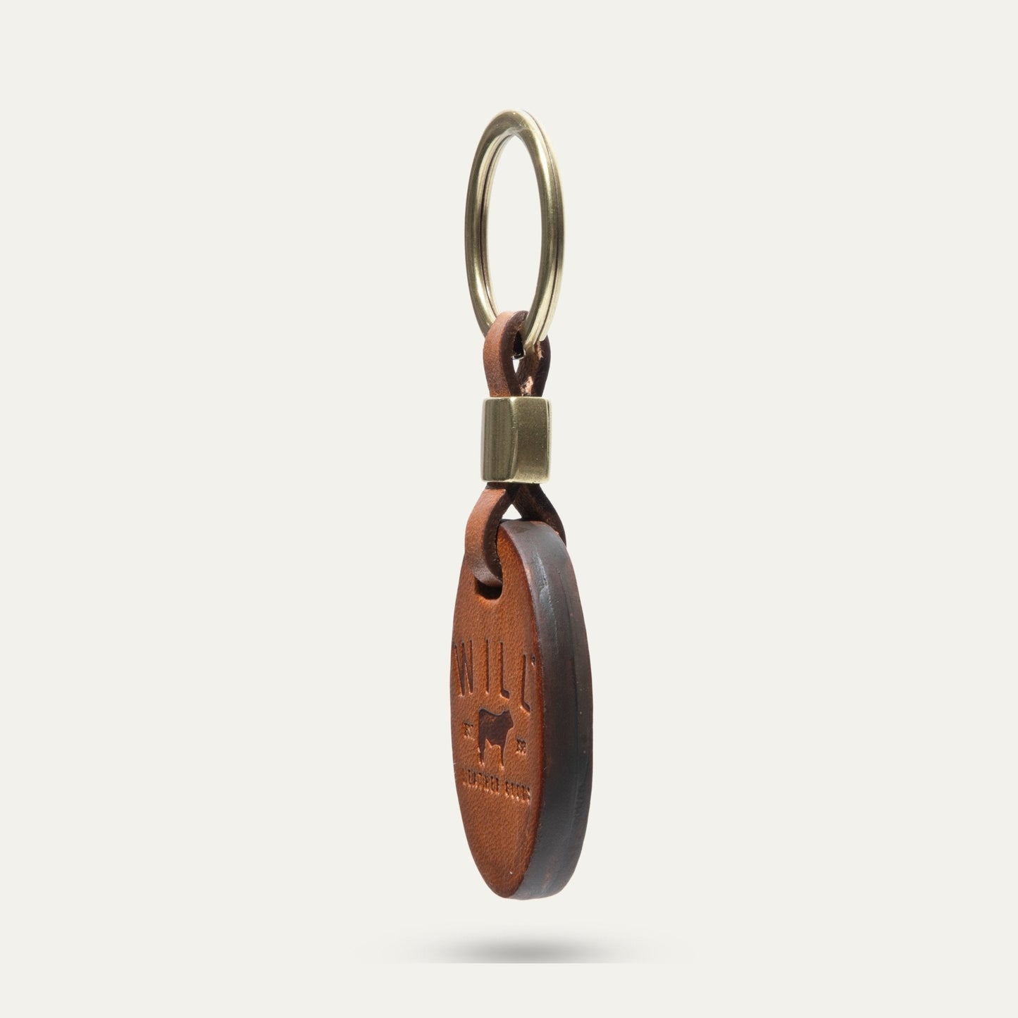Oval key fob by Will Leather Goods with brass ring and brown leather strap on Tampa Home & Garden Store