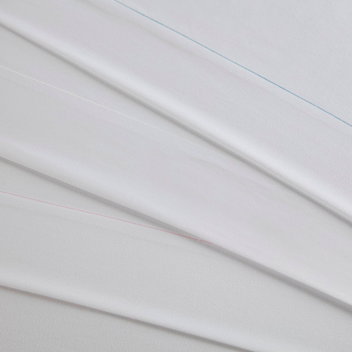 King Cotton Sheet Set in white with blue and pink stitched edges on Tampa Home & Garden Store