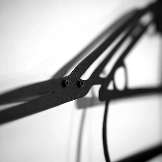 2006 Lancer Evo Metal Wall Art Spinning Wheels black metal frame close-up with bolts on Tampa Home & Garden Store