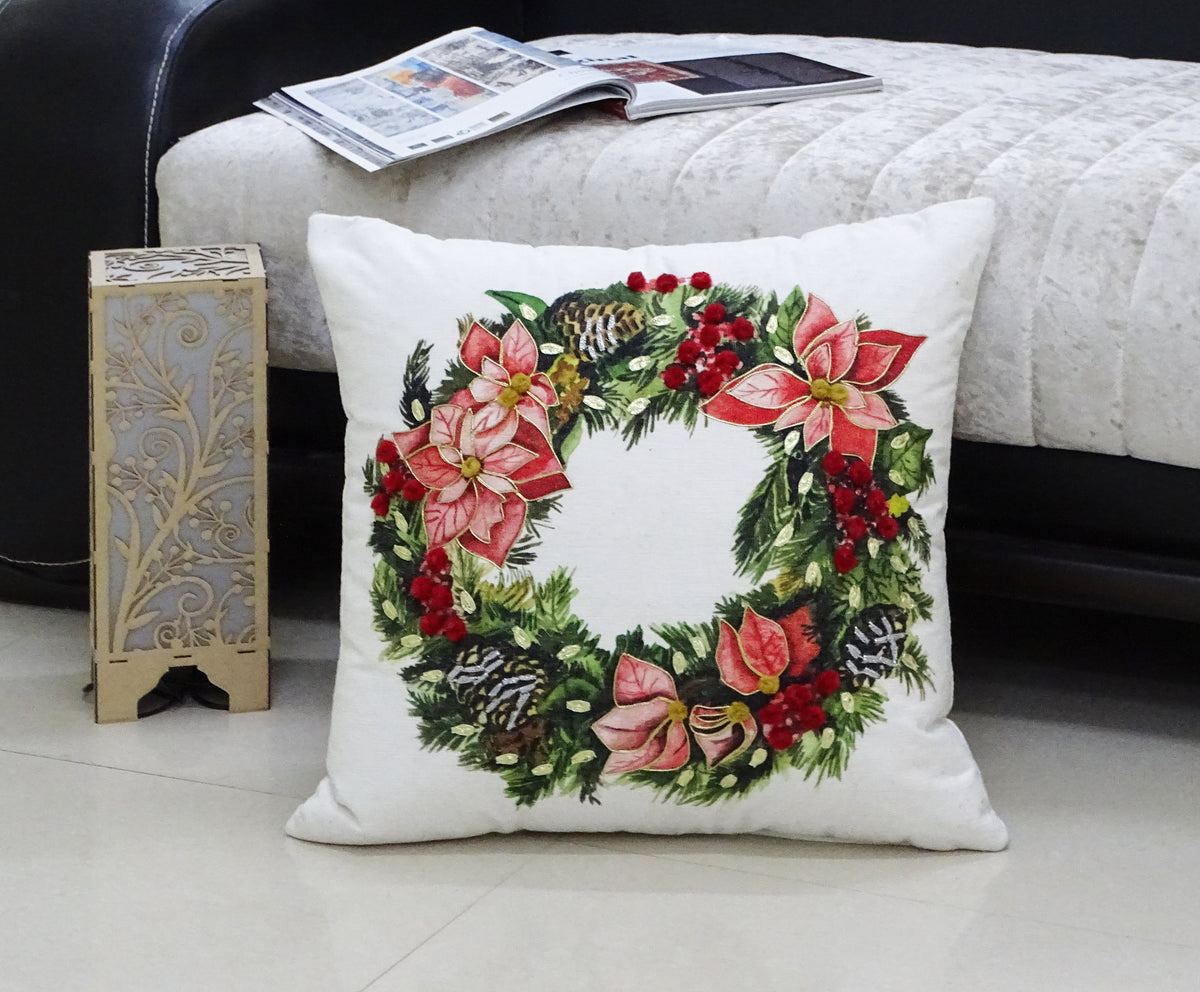 Vibhsa Christmas wreath decorative throw pillow white with red poinsettias and green foliage on Tampa Home & Garden Store
