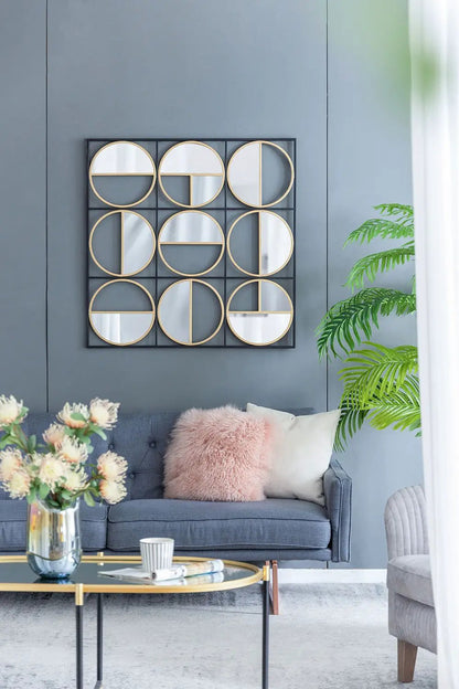 Eclectic metal beaded wall mirror with nine round mirrors in gold-trimmed circles on a black grid on Tampa Home & Garden Store