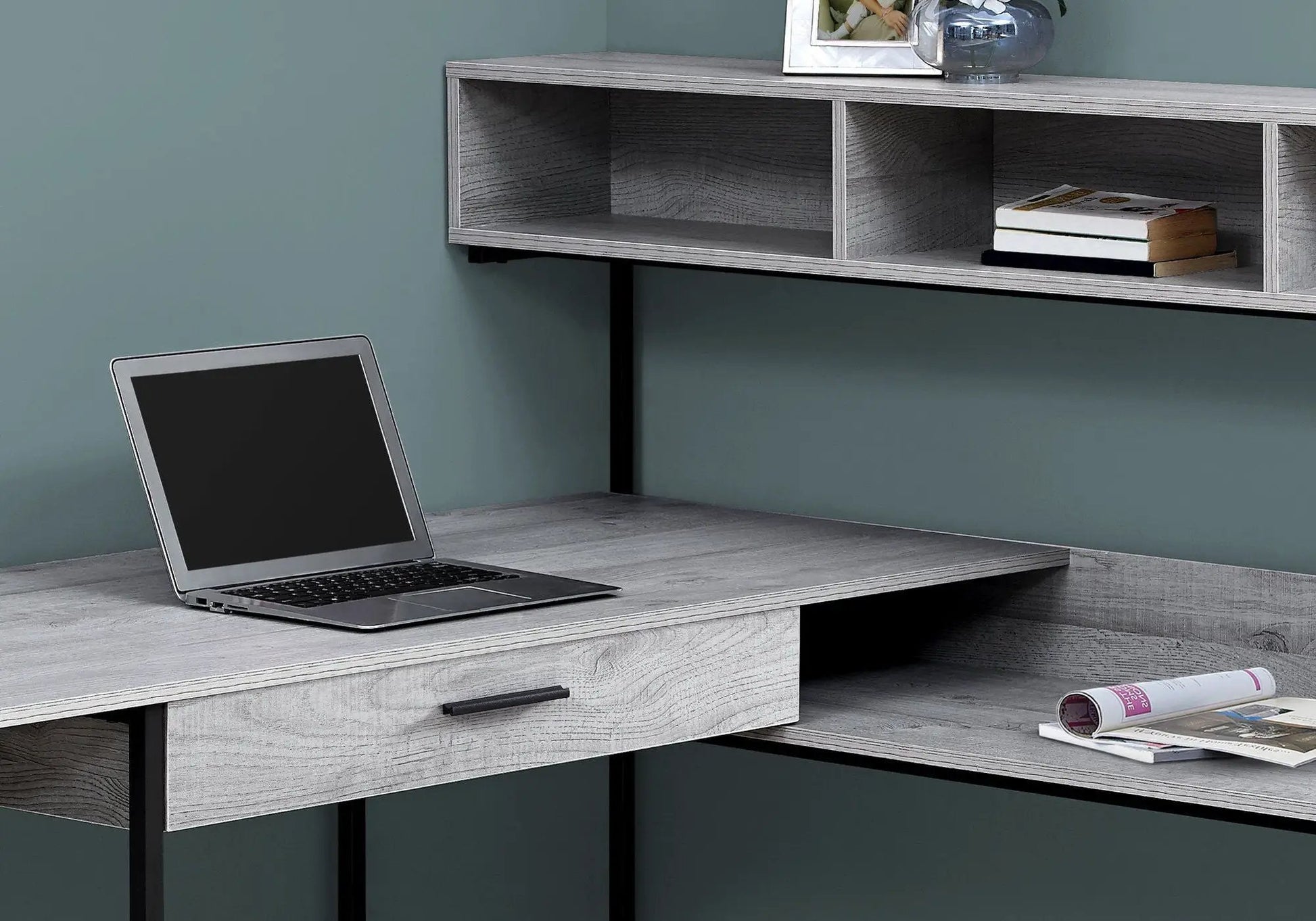 Light gray woodgrain L-shaped corner desk with open cubbies and black metal legs on Tampa Home & Garden Store