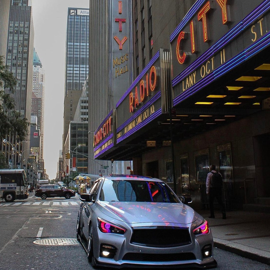 Infiniti Q50 RGBW Flow Series LED DRL Boards by AutoLEDTech on silver sedan with purple LEDs on Tampa Home & Garden Store