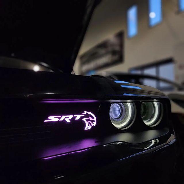 2015-2023 SRT Hellcat RGBW Flow Series LED badge emblem on a dark car with purple glow on Tampa Home & Garden Store