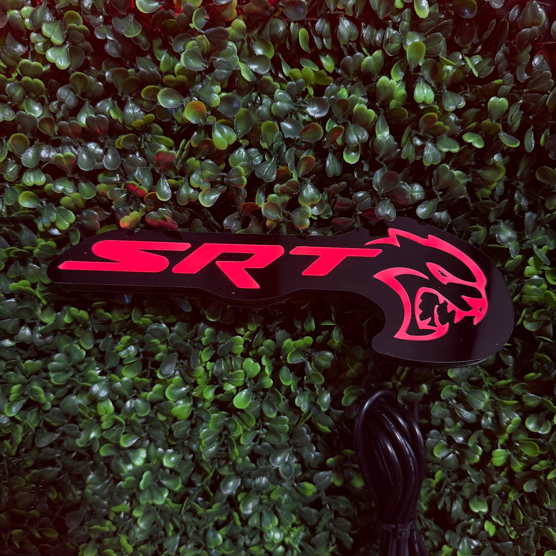SRT Hellcat RGBW Flow Series LED badge emblem on black housing with pink logo AutoLEDTech.com on Tampa Home & Garden Store