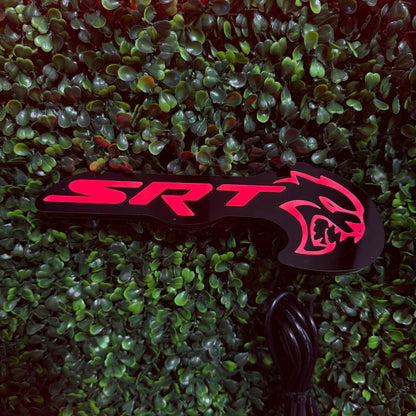 SRT Hellcat RGBW Flow Series LED badge emblem on black housing with pink logo AutoLEDTech.com on Tampa Home & Garden Store