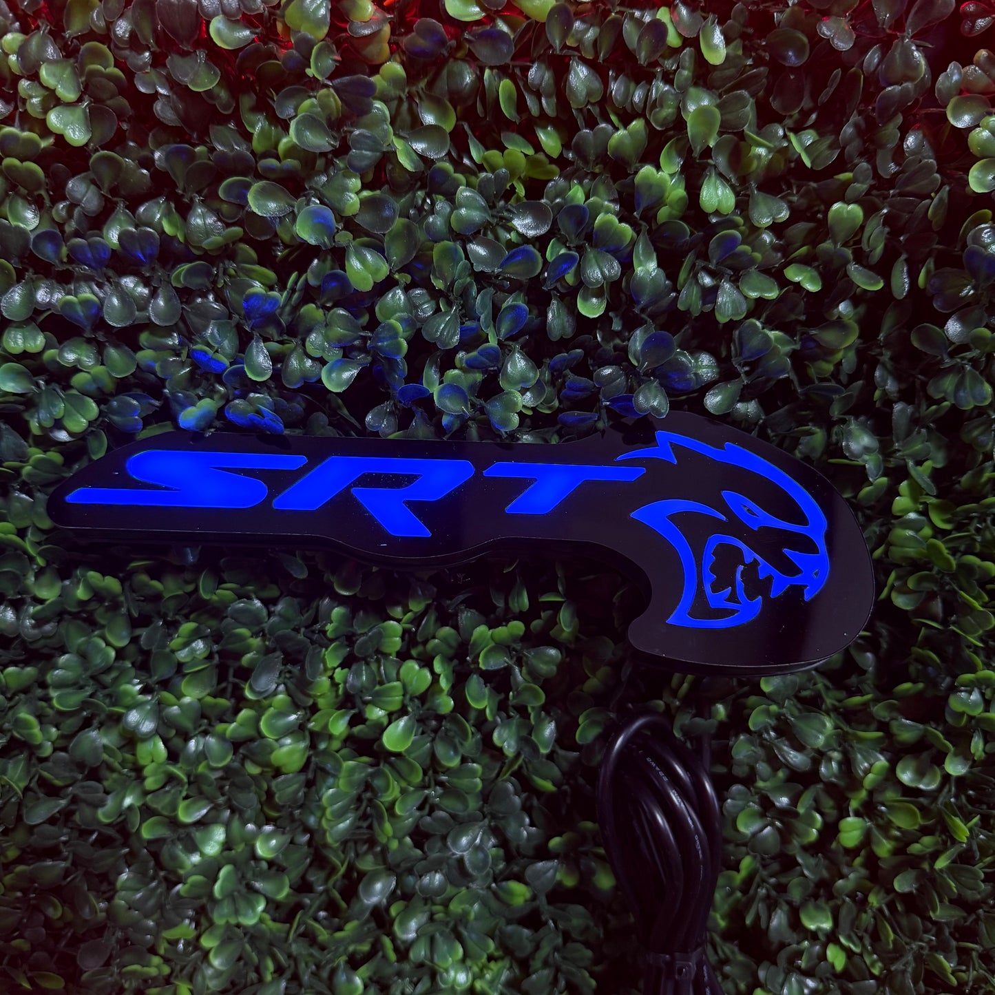 SRT Hellcat RGBW Flow Series LED badge emblem, blue illuminated logo on black base on Tampa Home & Garden Store
