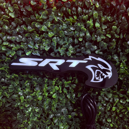 LED badge emblem SRT Hellcat RGBW Flow Series by AutoLEDTech.com on black curved surface on Tampa Home & Garden Store
