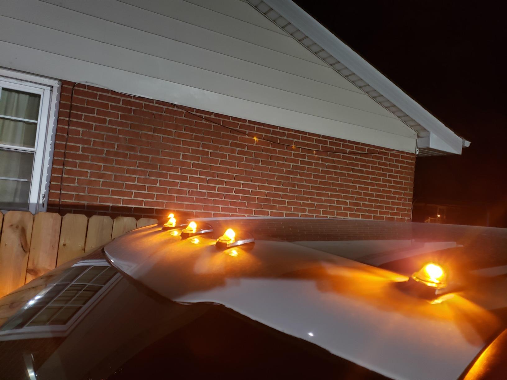 Ford F250/F350 Super Duty amber roof cab lights by AutoLEDTech.com on white pickup roof on Tampa Home & Garden Store