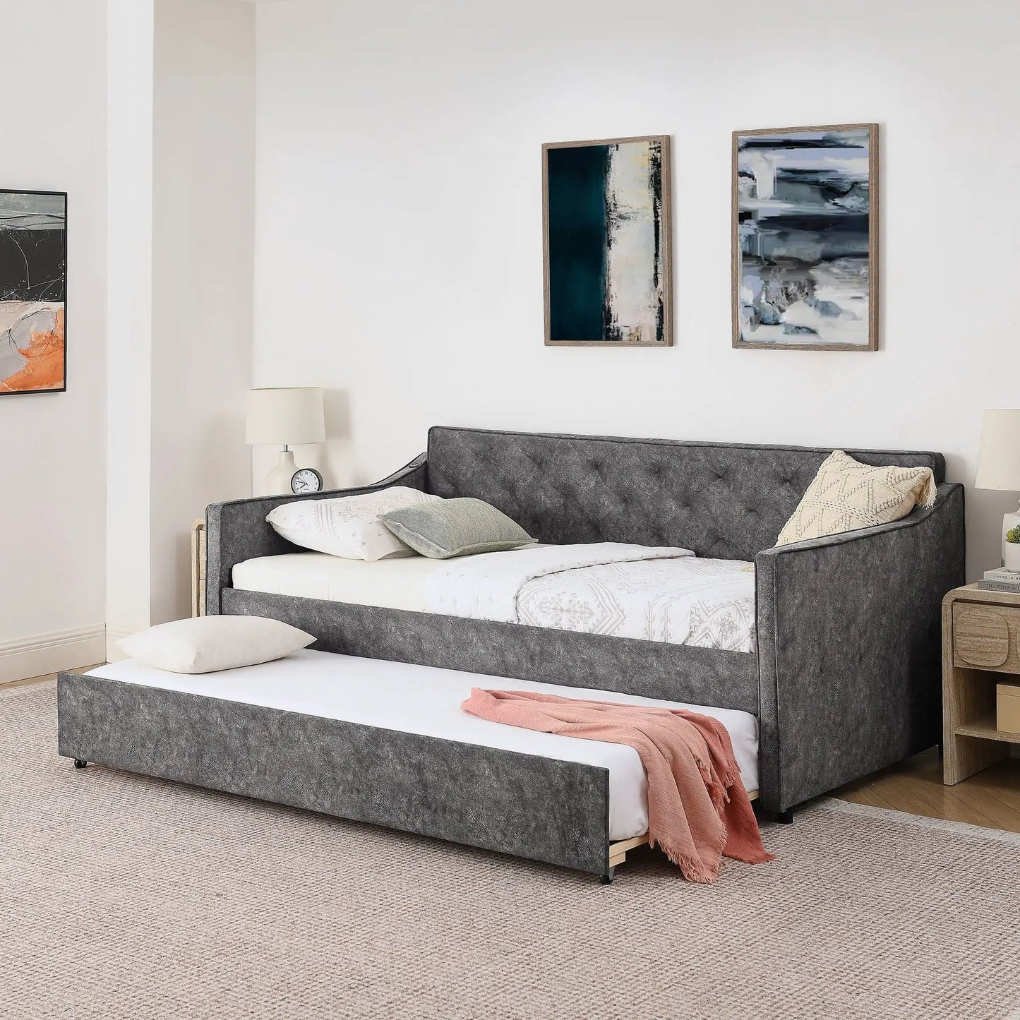 Daybed with pop-up trundle and USB charging armrest in dark grey fabric, white bedding on Tampa Home & Garden Store