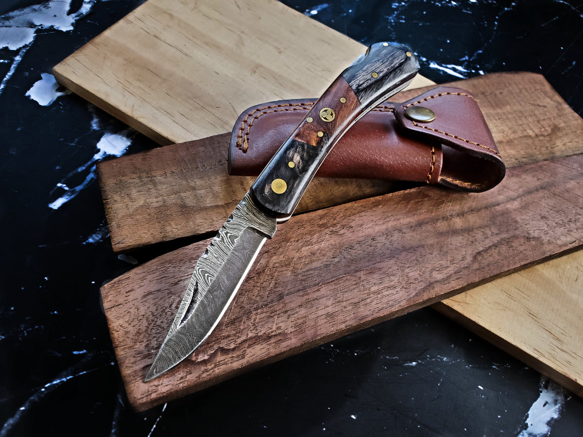 TF-009 Titan knife with Damascus blade, bone/horn handle, brass pins, leather sheath on wooden board on Tampa Home & Garden Store