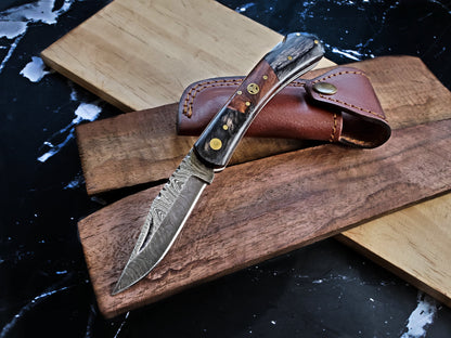 TF-009 Titan knife with Damascus blade, bone/horn handle, brass pins, leather sheath on wooden board on Tampa Home & Garden Store