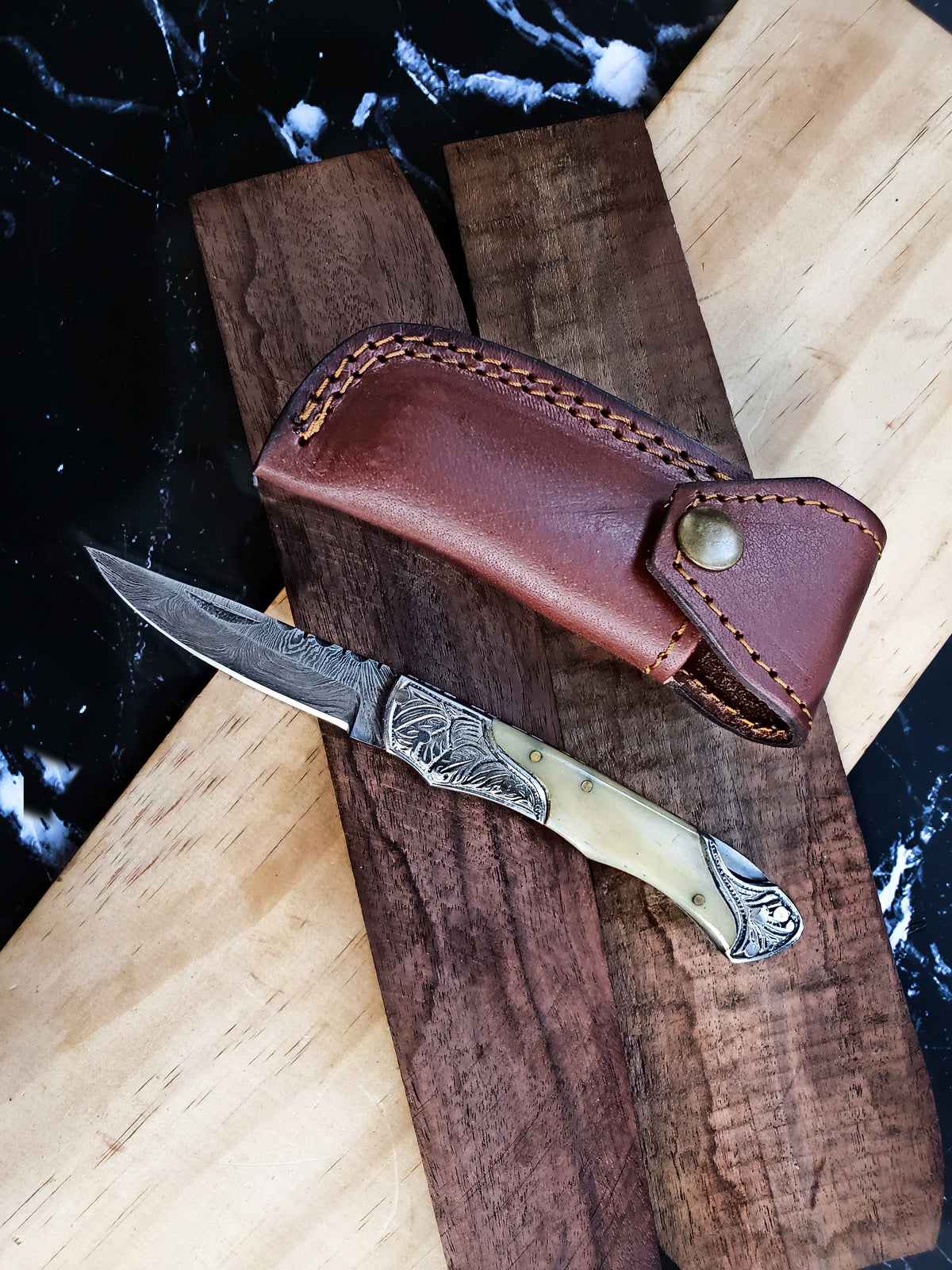 TF-005 Titan International K knife with Damascus blade and handle in brown leather sheath on Tampa Home & Garden Store