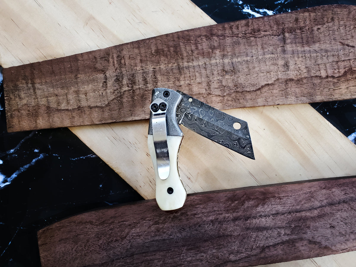 TF-007 folding knife with Damascus-pattern blade and ivory handle by Titan International K on Tampa Home & Garden Store