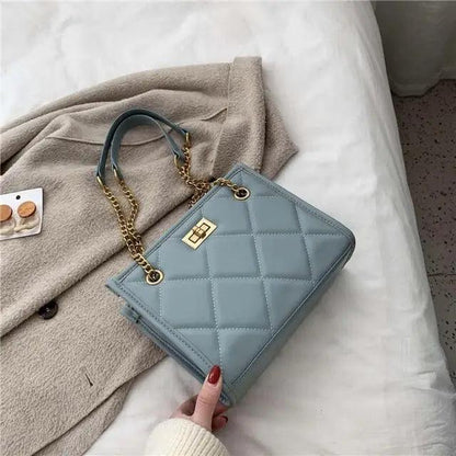 Stevvex quilted PU leather shoulder bag in light blue with gold chain strap and turn-lock on Tampa Home & Garden Store