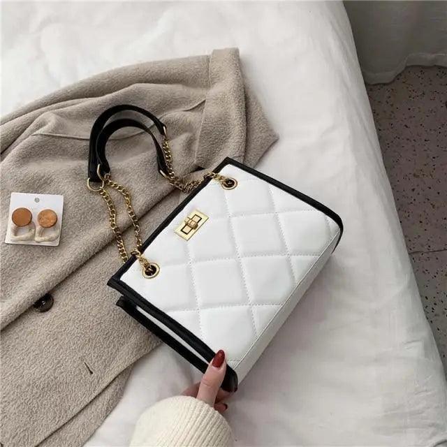 Stevvex white quilted PU leather shoulder bag with black trim and gold chain strap on Tampa Home & Garden Store