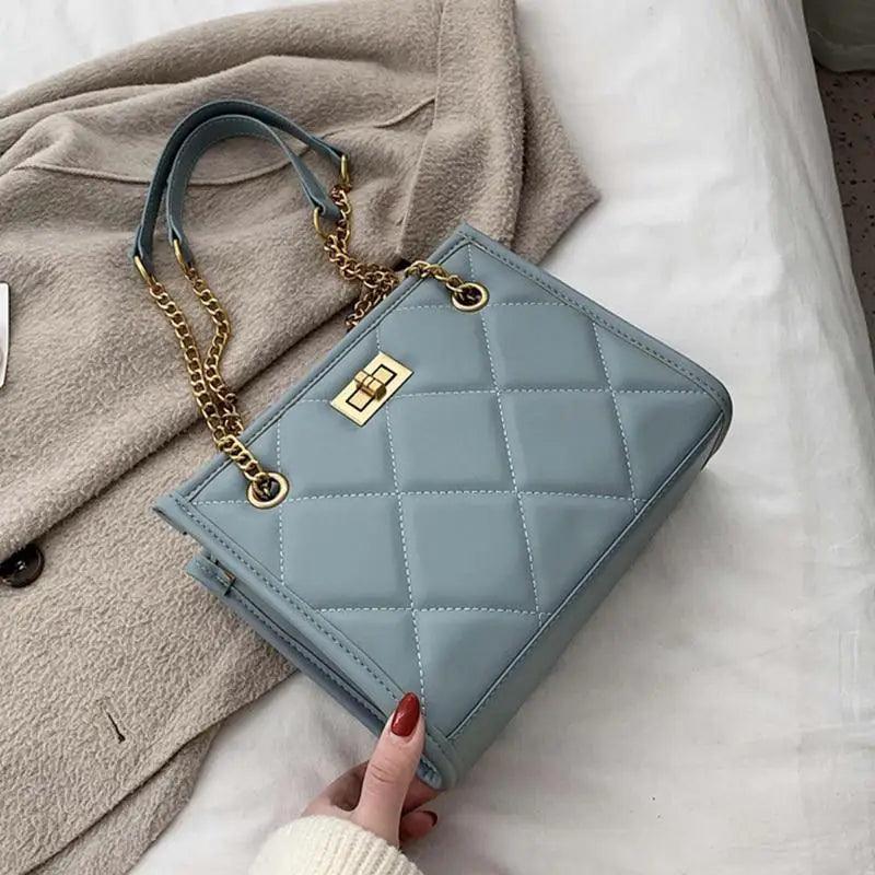 Stevvex quilted PU leather shoulder bag in pale blue with gold chain strap and top handle on Tampa Home & Garden Store