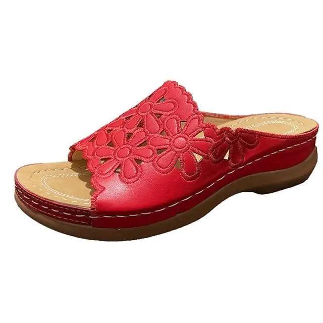 Red floral-cutout open-toe leather sandal with cushioned insole and brown wedge sole on Tampa Home & Garden Store