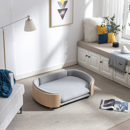 Scandinavian style elevated dog bed with solid wood legs and light blue velvet cushion on Tampa Home & Garden Store