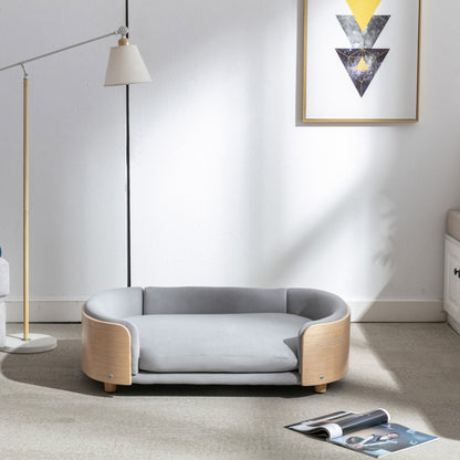 Scandinavian style elevated dog bed with solid wood legs and grey velvet cushion on Tampa Home & Garden Store