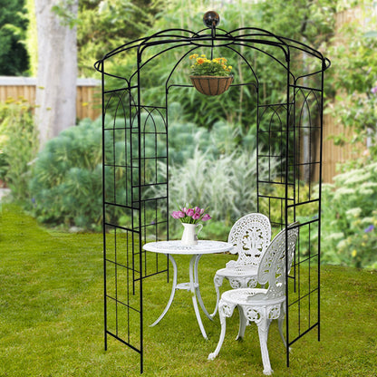 Black metal garden arch with hanging flower basket, iron trellis gazebo and patio furniture on Tampa Home & Garden Store