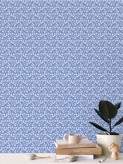 Genevieve Wallpaper Blue, repeat-pattern wallcovering by Erin Donahue Tice with white leaf motif on Tampa Home & Garden Store
