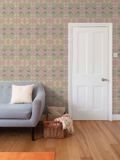 Antonia Mauve Wallpaper, repeat pattern Erin Donahue Tice with green leaves and yellow blossoms on Tampa Home & Garden Store