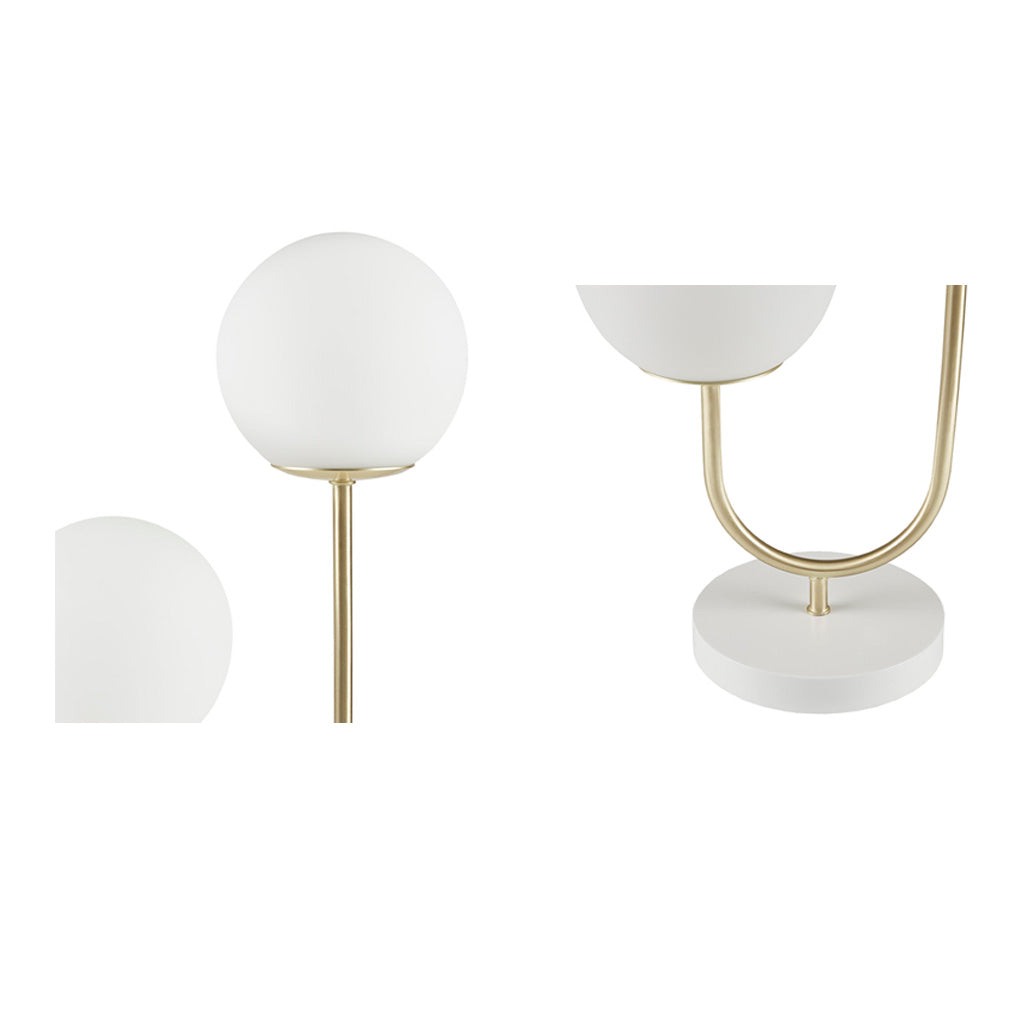 Metal 2-light lamp with two glass globes and brass arms on a base on Tampa Home & Garden Store