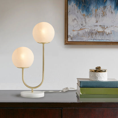 Metal 2-Light Globe Table Lamp with brass-tone frame and two frosted globes on white base on Tampa Home & Garden Store
