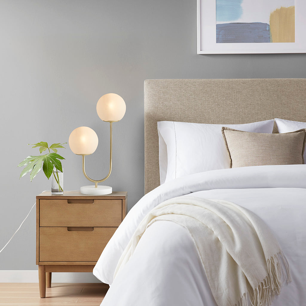 Metal 2-Light Globe Table Lamp with frosted glass globes, brass-gold finish on wood nightstand on Tampa Home & Garden Store