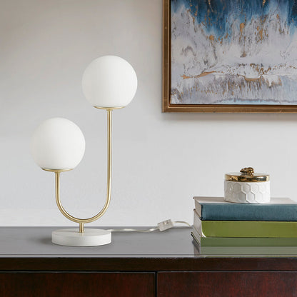 Metal 2-Light Globe Table Lamp with brass U-shaped frame and white glass globes on a white base on Tampa Home & Garden Store