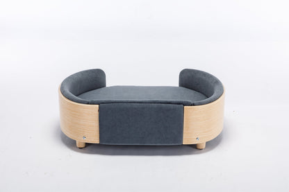 Scandinavian style elevated dog bed with dark blue velvet cushion and light wood frame on Tampa Home & Garden Store
