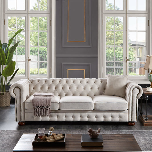 Chesterfield Sofa beige tufted upholstery with rolled arms and nailhead trim in a bright living room on Tampa Home & Garden Store
