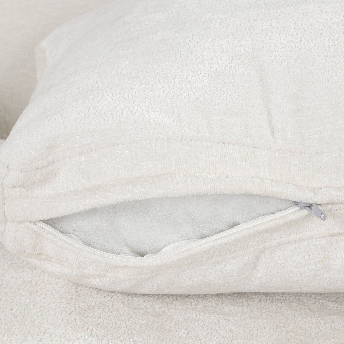 Cream velvet accent armchair upholstery closeup with zipper detail on Tampa Home & Garden Store