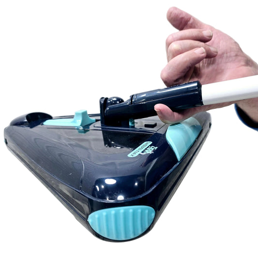 Hand holding a zippi max sweeping device that's very light weight .