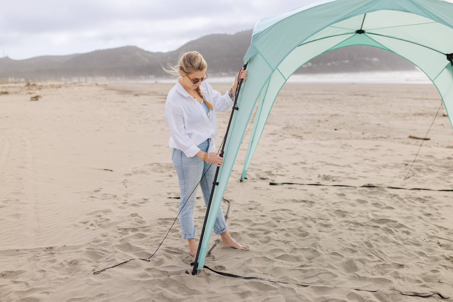 Pop 'N Go Canopy mint teal popup canopy by The California Beach Company LLC on sandy beach on Tampa Home & Garden Store