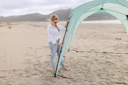 Pop 'N Go Canopy mint teal popup canopy by The California Beach Company LLC on sandy beach on Tampa Home & Garden Store