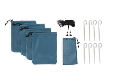 Pop 'N Go canopy components in blue carry bags with stakes and guy lines on Tampa Home & Garden Store
