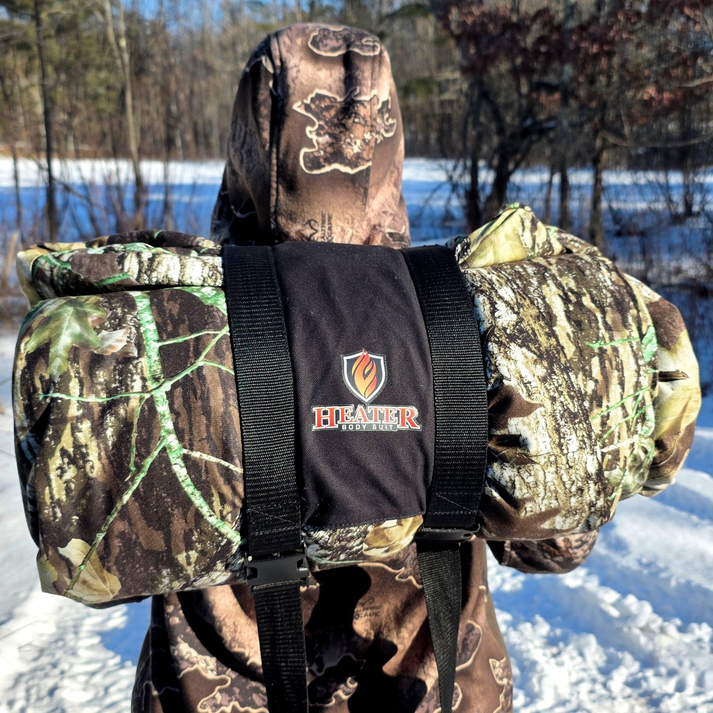 Heater Body Suit AP hunting jacket in woodland camo with black straps on Tampa Home & Garden Store