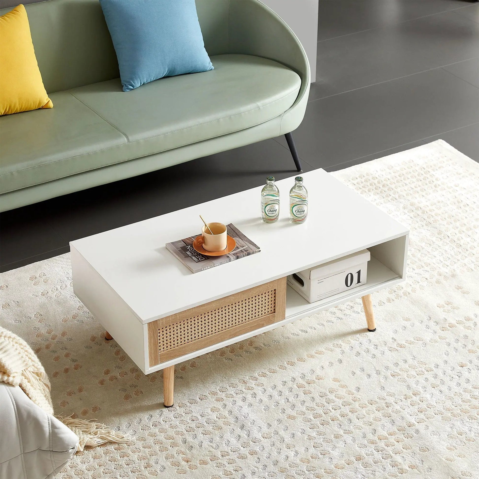 Rattan coffee table with sliding storage, white top and natural wood legs on Tampa Home & Garden Store