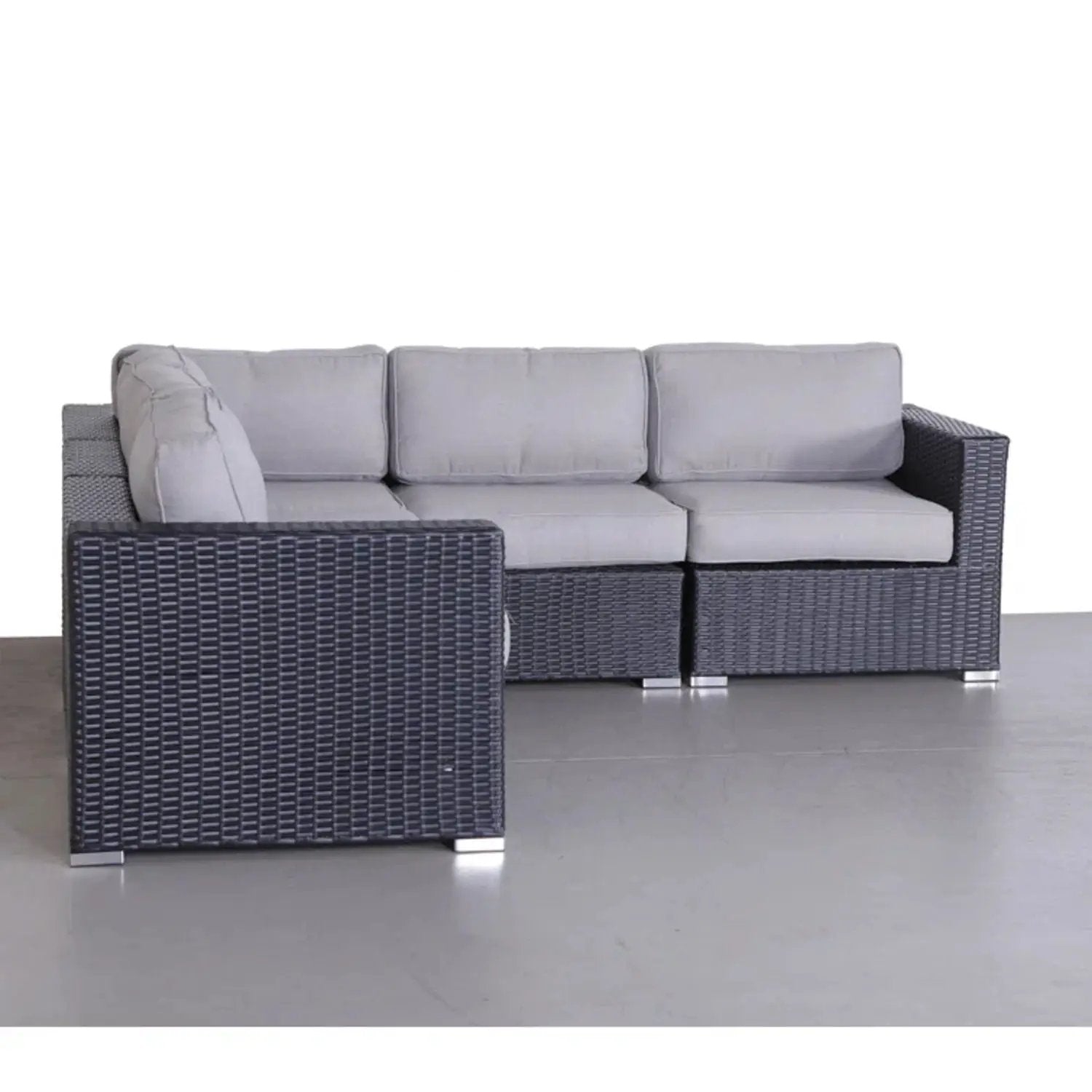 Luxurious wicker patio sectional with light gray Sunbrella cushions on a dark woven frame on Tampa Home & Garden Store