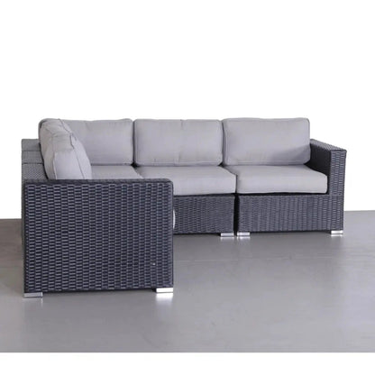 Luxurious wicker patio sectional with light gray Sunbrella cushions on a dark woven frame on Tampa Home & Garden Store