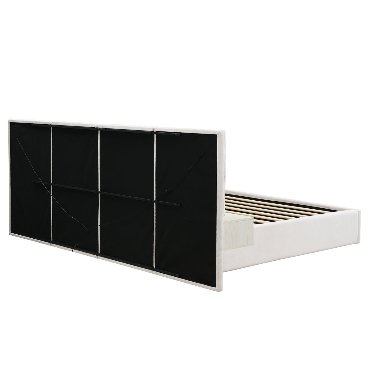 King upholstered bed with black paneled headboard, white frame, visible slatted base on Tampa Home & Garden Store