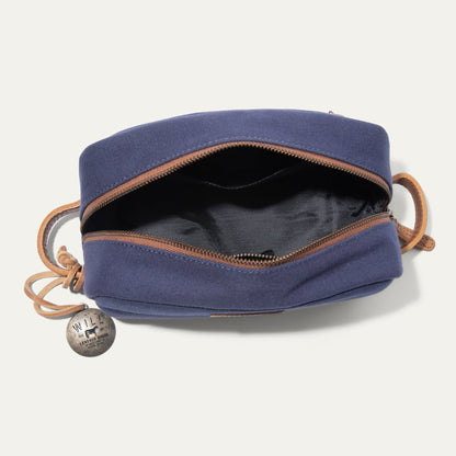 Commuter Travel Kit bag in navy canvas with brown leather trim; Will Leather Goods tag on Tampa Home & Garden Store